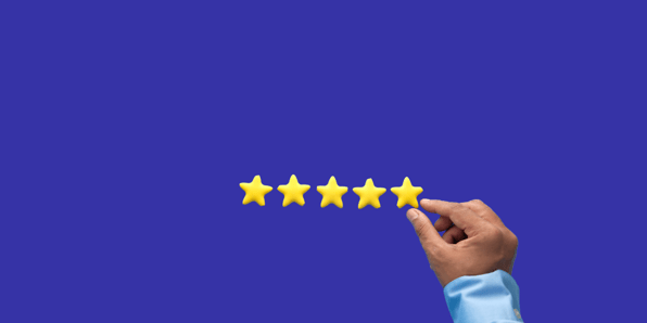 Image of a hand holding up five stars
